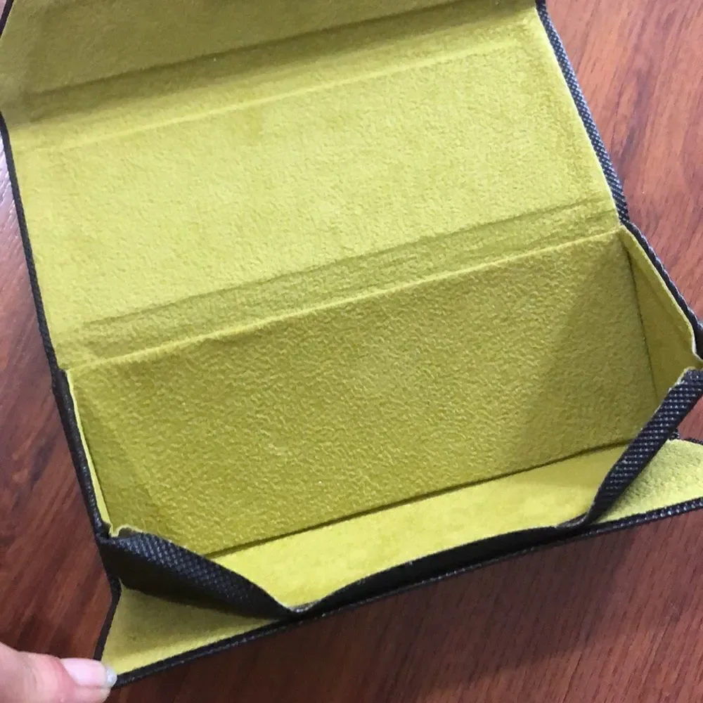 Nicole Miller Black hard triangular eyeglass case.